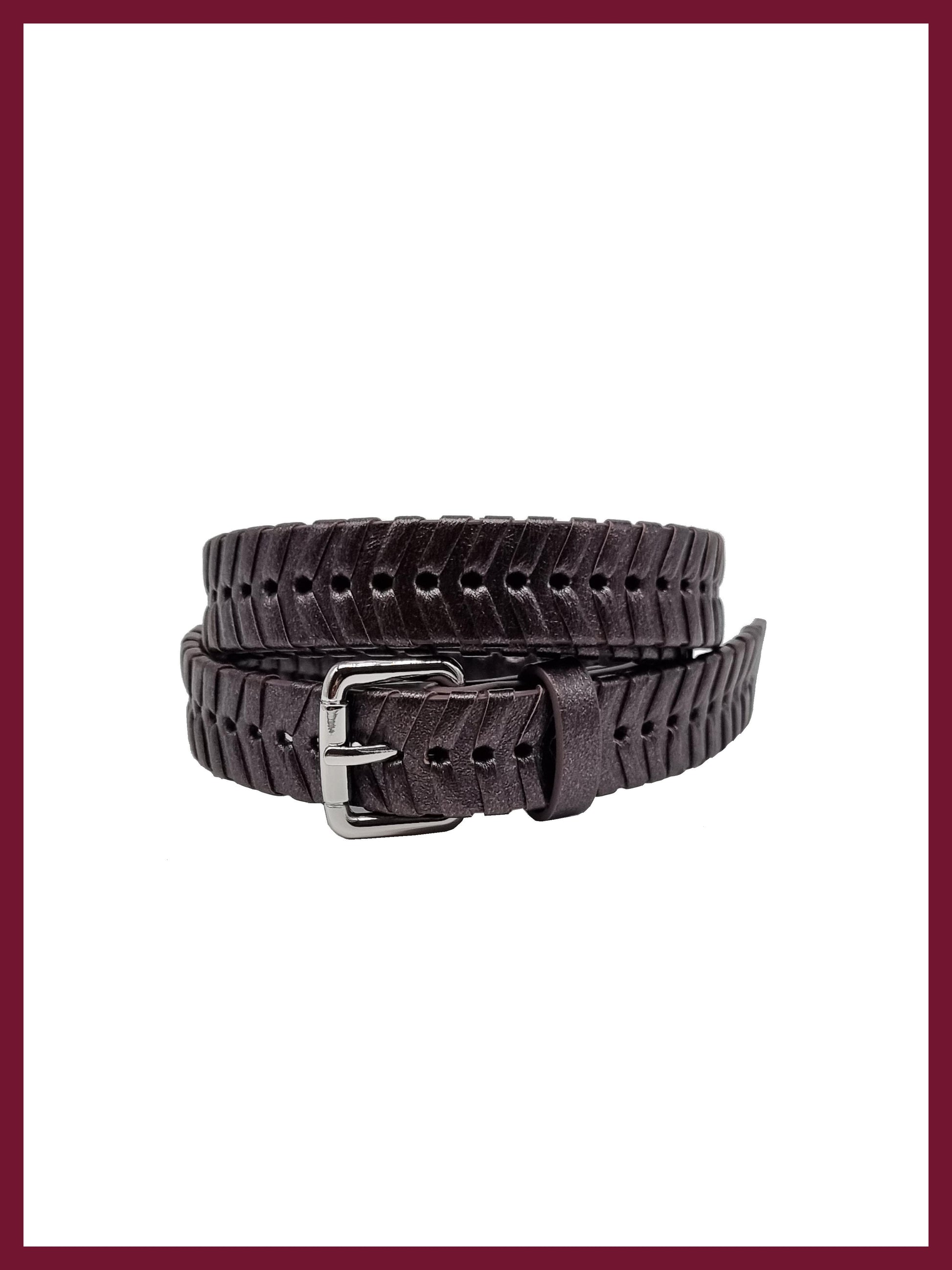 Gunmetal woven belt in vegan leather with silver buckel coiled up.