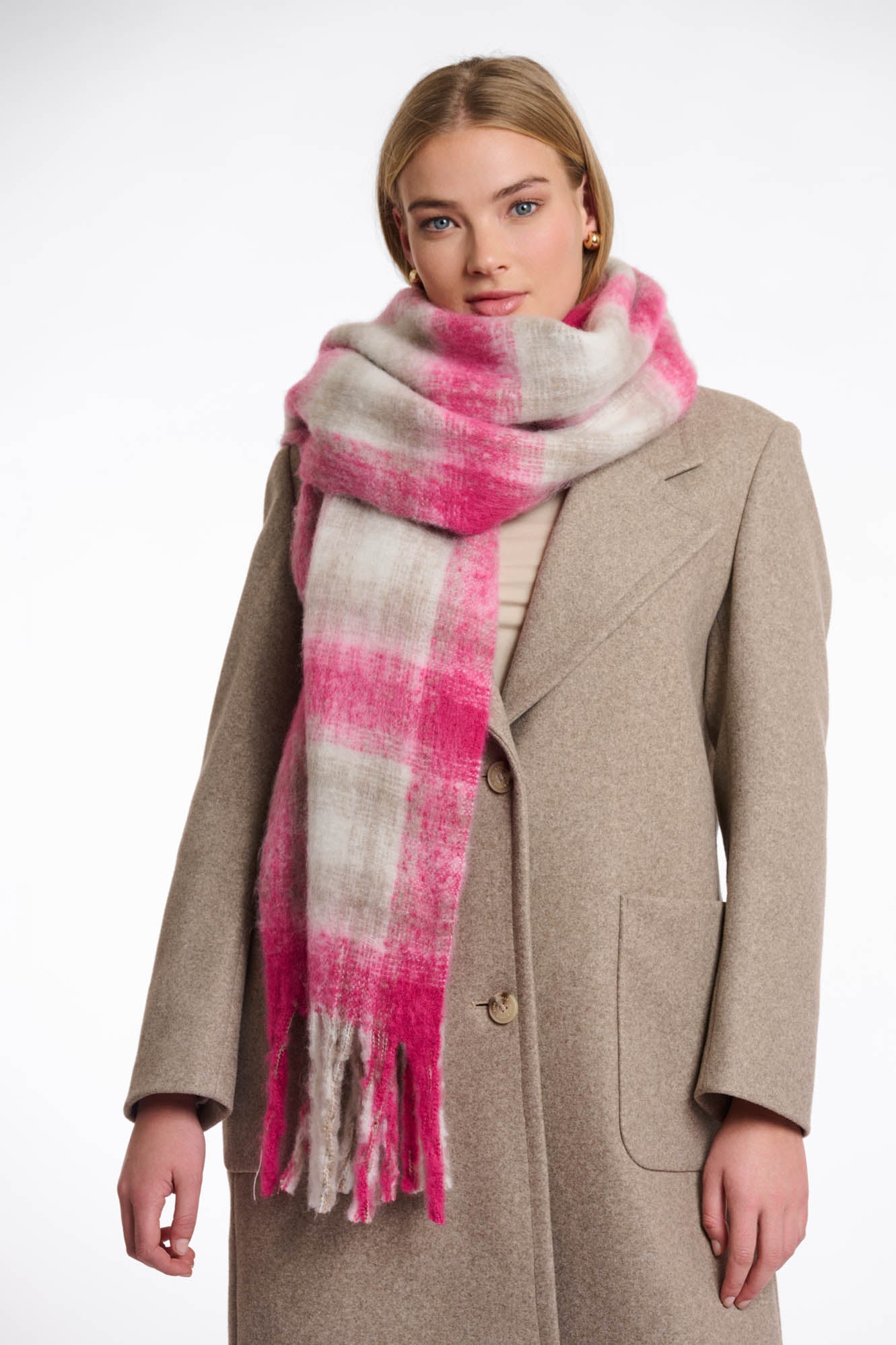 Rino Pelle Hipke Pink checked scarf worn by woman in tan coat