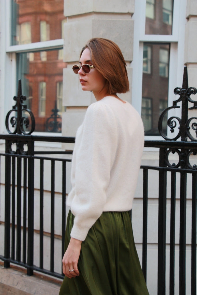 cream puff sleeve jumper shown on model from back