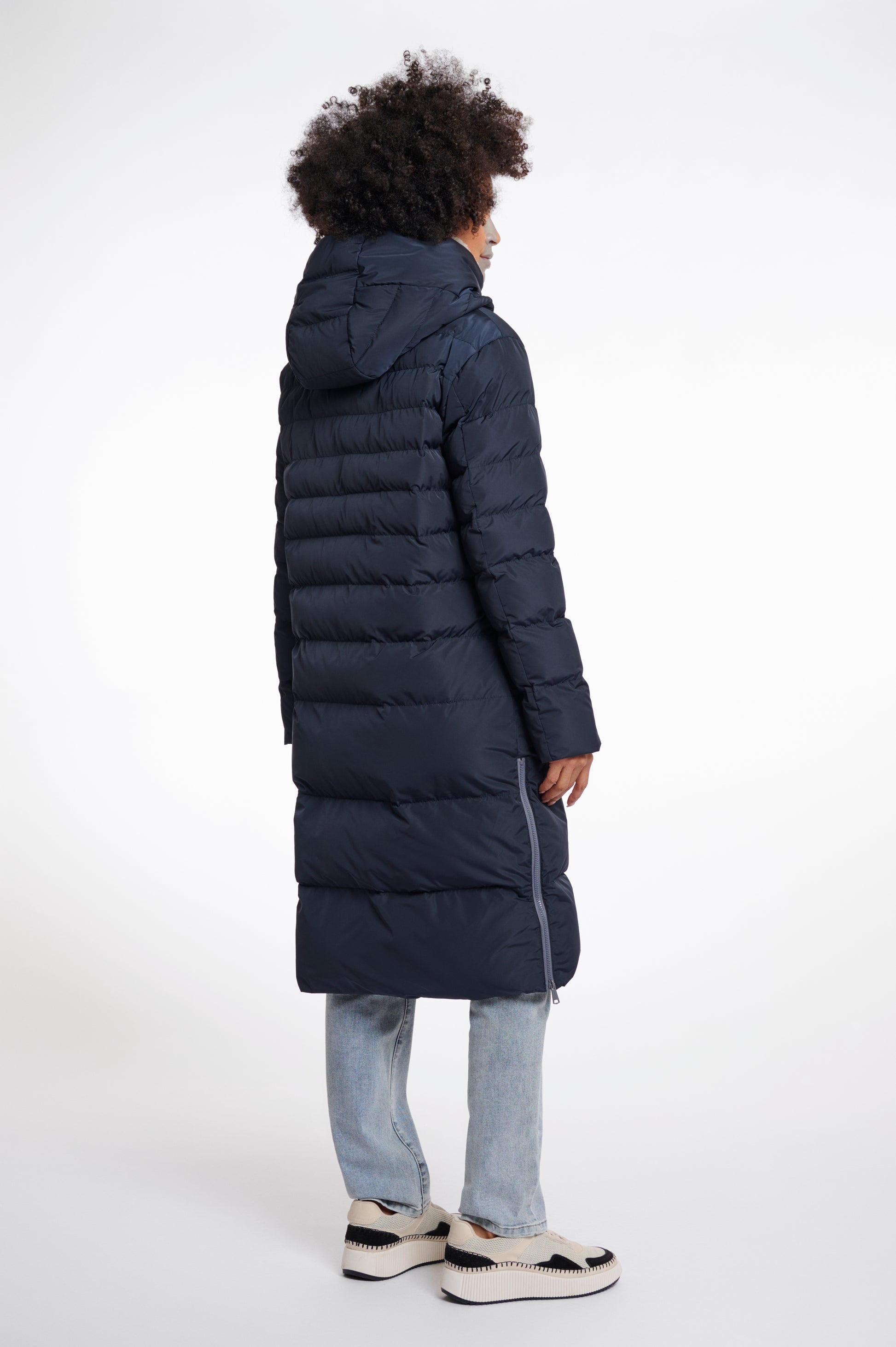 Navy longline coat with zip closure and side slit zips 