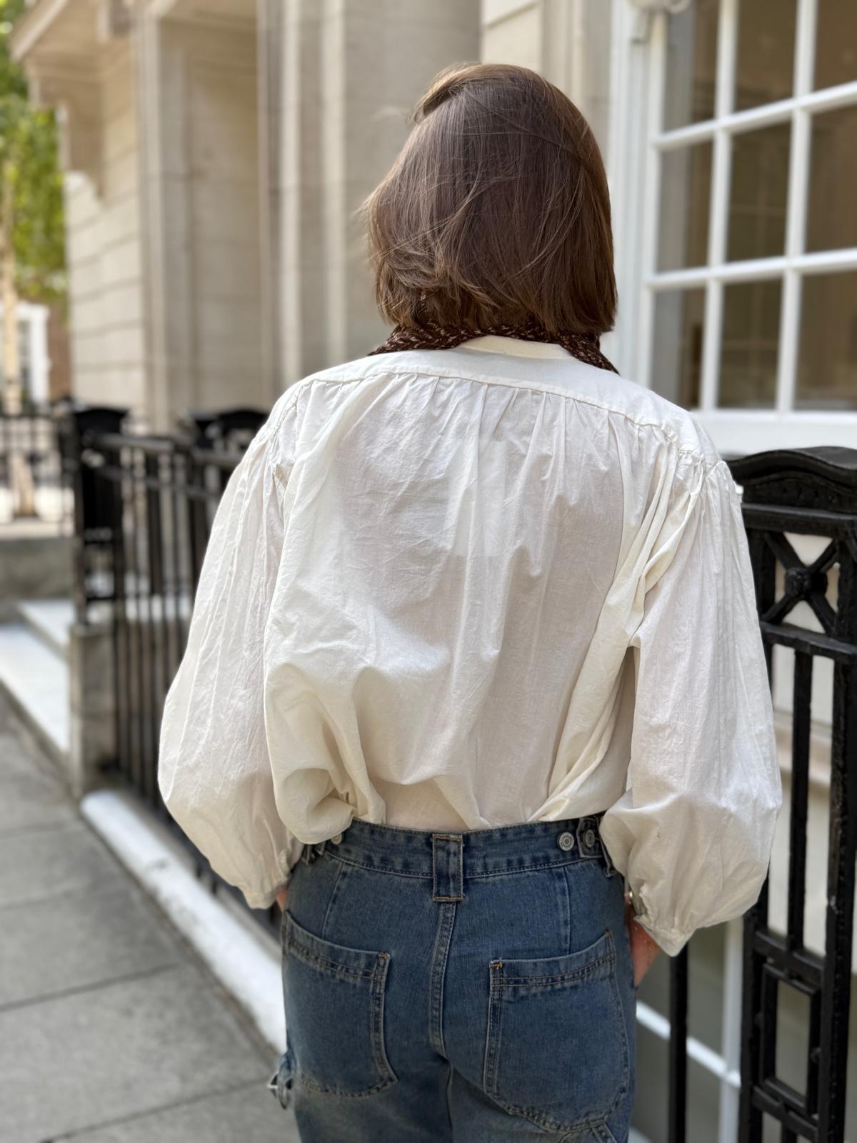 Timeless cream cotton frill blouse shown from back
