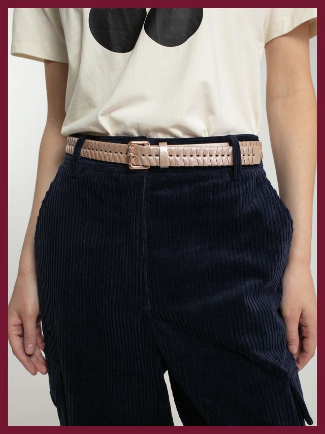 Nooki woven gold belt in vegan leather shown on model