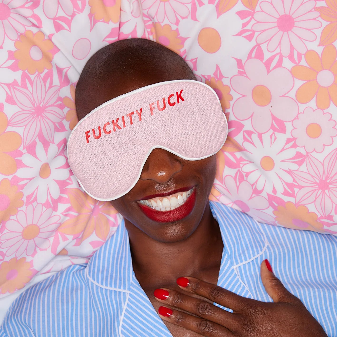 Caroline Colebrook pale pink linen Lavender-filled linen eye mask with red slogan saying "fuckity fuck"

